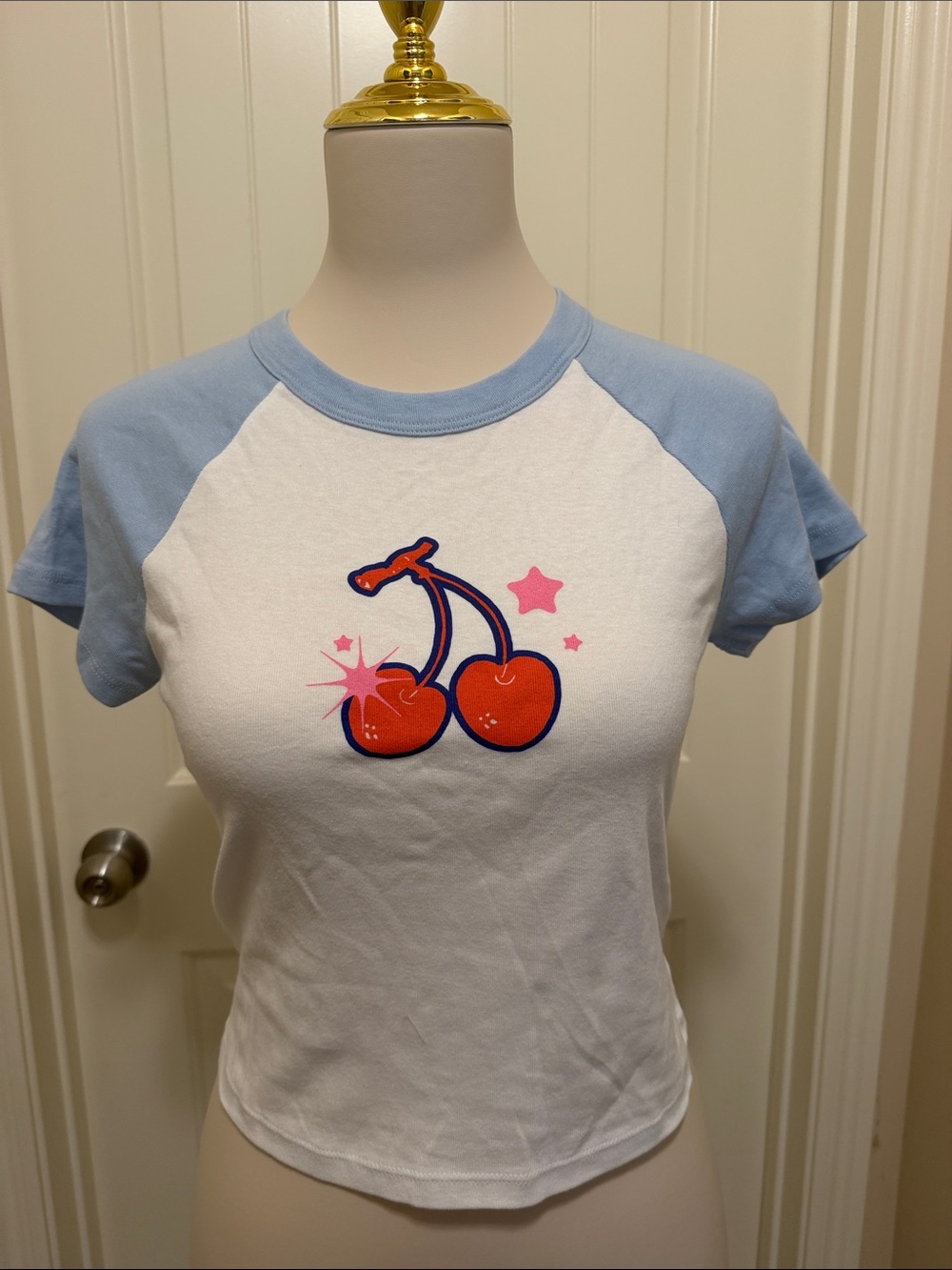Girls' White Raglan Tee with Light Blue Sleeves and Cherry Graphic